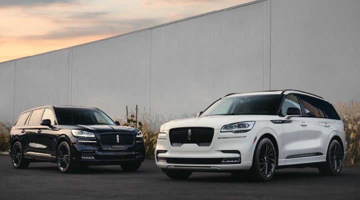 Two Lincoln Aviator® SUVs are shown with the available Jet Appearance Package | Rogers Lincoln in Midland TX